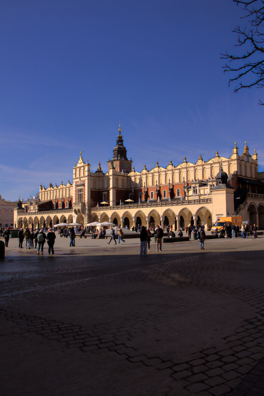 Kraków Cloth Hall (Sukiennice) and the Main Market Square under a clear blue sky, Poland