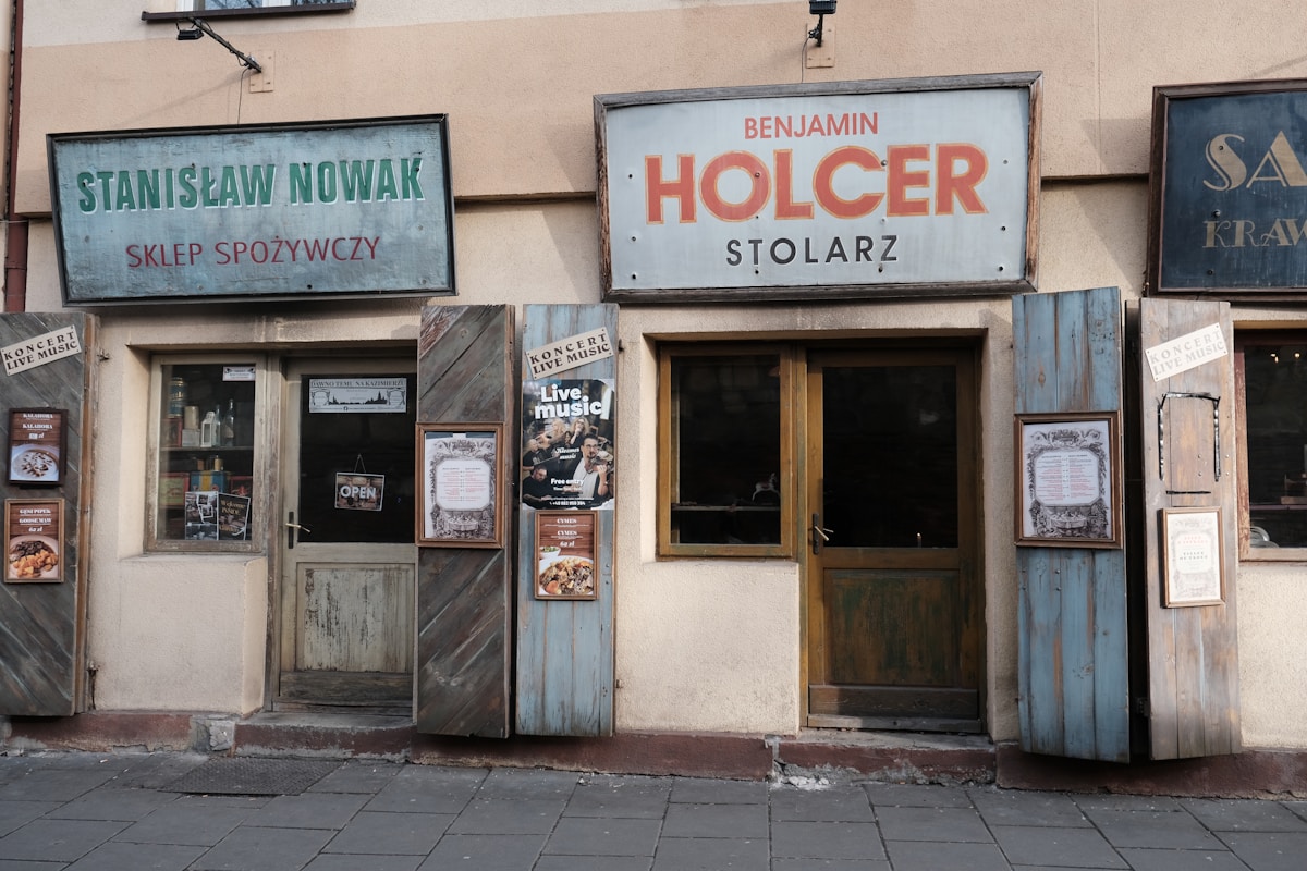 Vintage shopfronts with Polish signs in Kazimierz district, Kraków, Poland