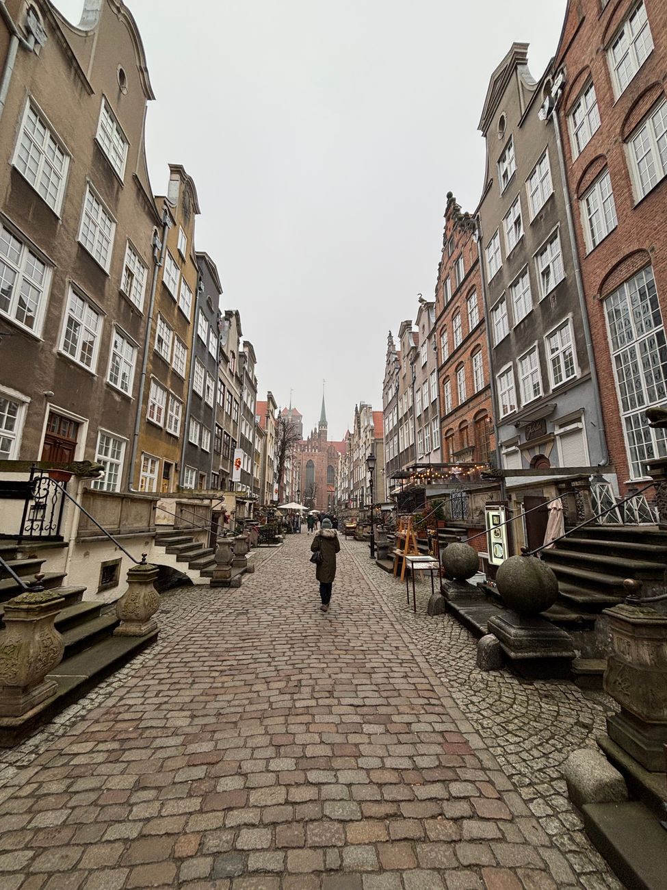 Historic Long Lane street in Gdańsk Old Town, lined with restaurants and cafés