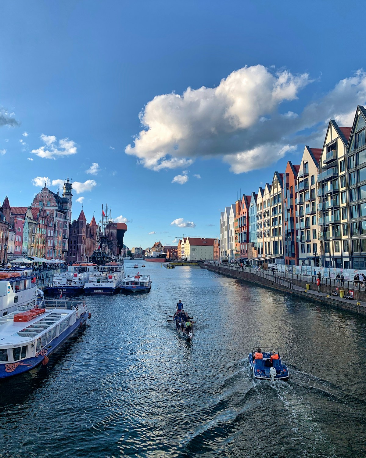 Colourful waterfront buildings and boats on the Motława River in Gdańsk, Poland