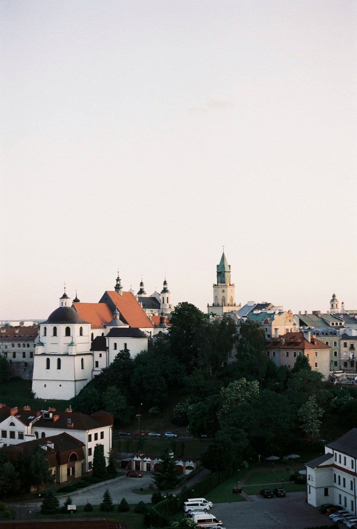 Panoramic view of Lublin old town with church spires and historic buildings at dusk, eastern Poland