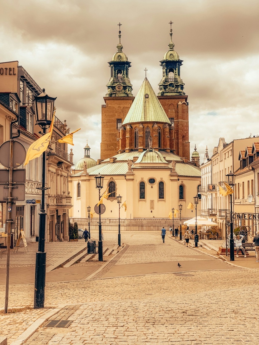 Gniezno Cathedral with twin towers rising above the historic town square, Greater Poland region