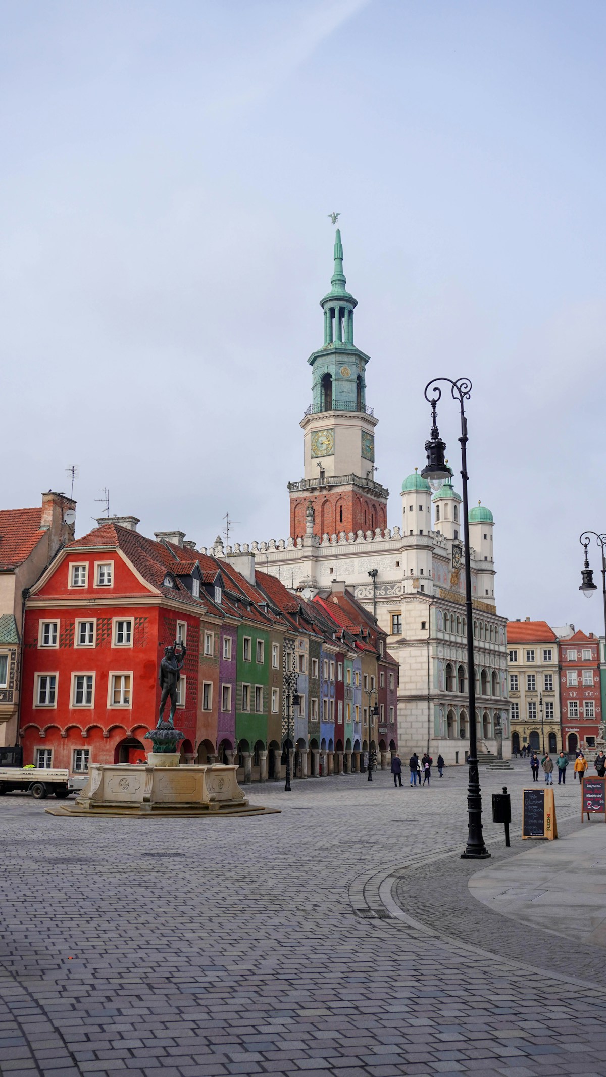 Colourful townhouses and clock tower on Poznań's Old Market Square, Poland