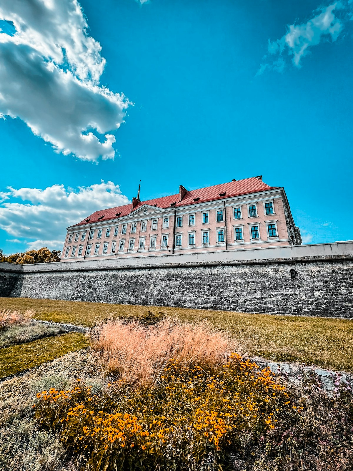 Baroque Lubomirski Castle with stone walls and autumn garden in Rzeszów, Subcarpathia, Poland