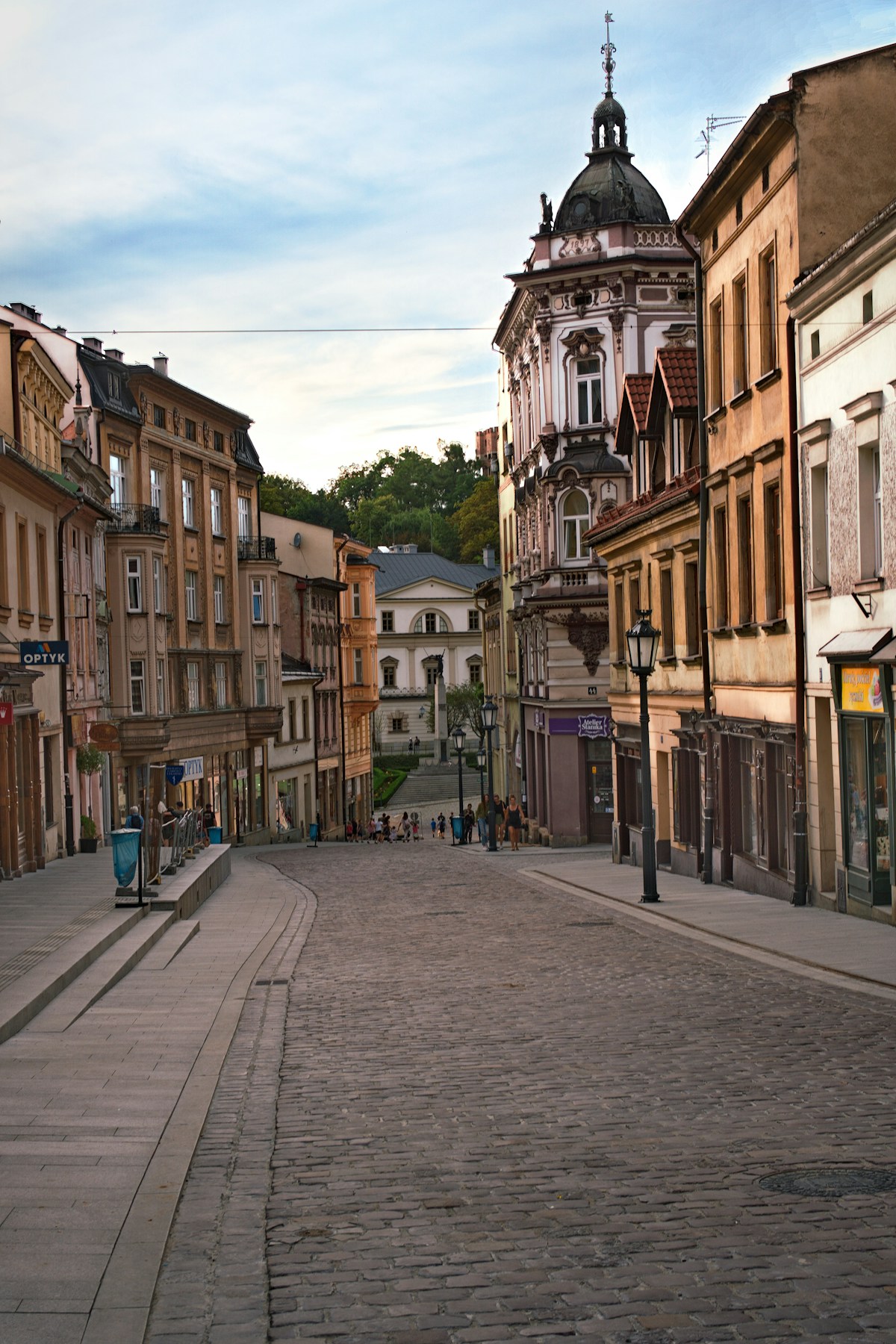 Cobblestone street in the historic Old Town of Toruń lined with Baroque and Gothic tenement houses, northern Poland