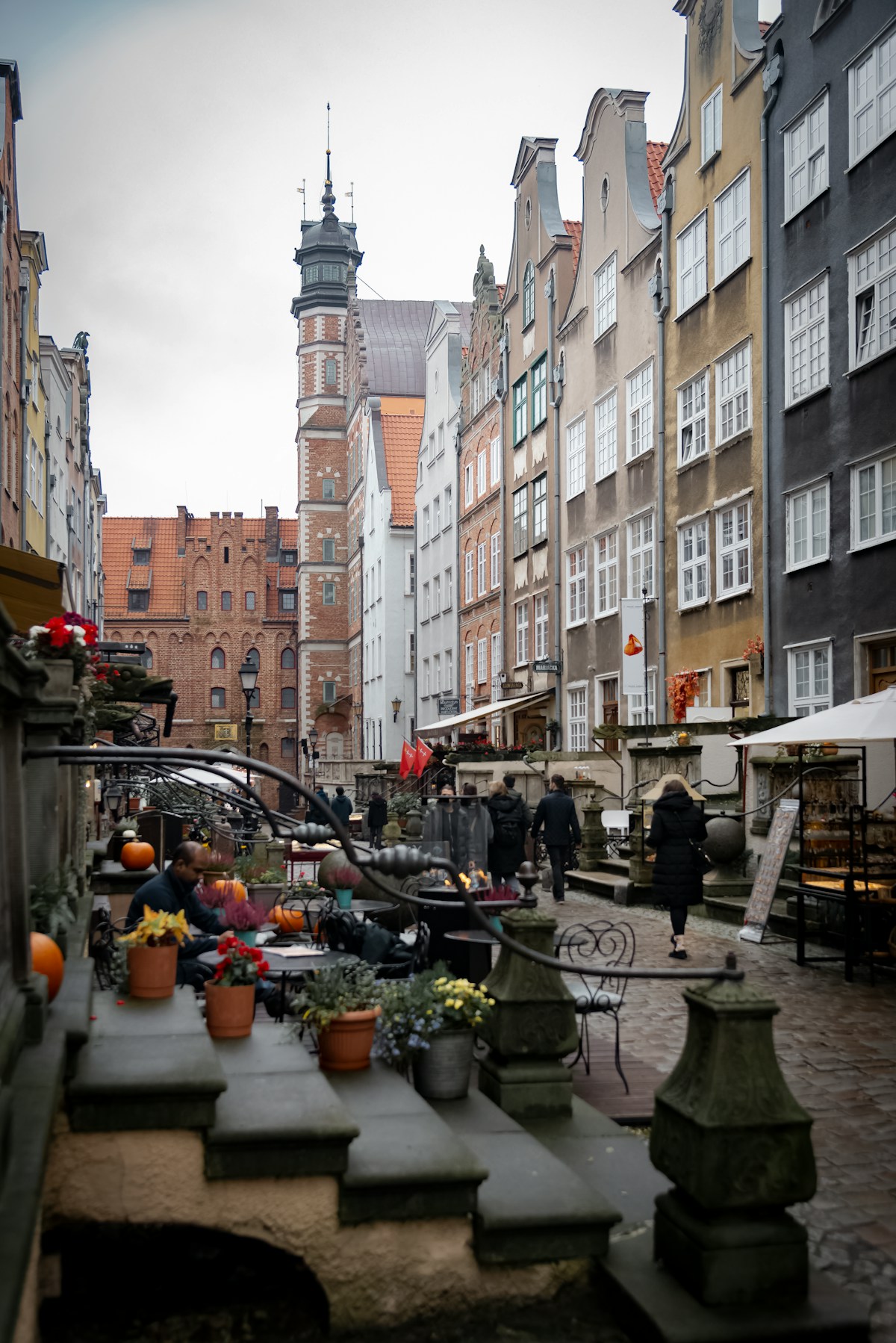 Outdoor dining on a cobblestone street in a Polish old town