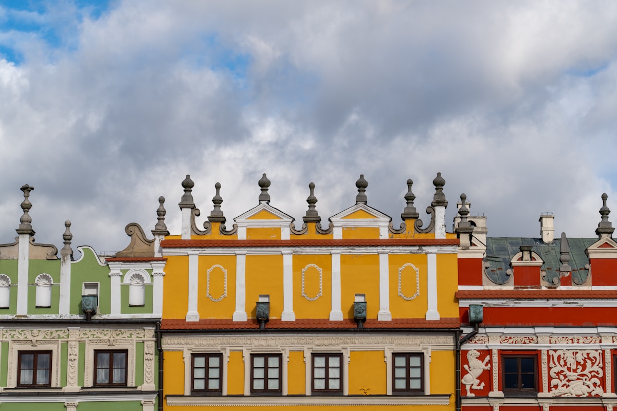Colourful Renaissance arcaded buildings lining the Great Market Square in Zamość, Poland