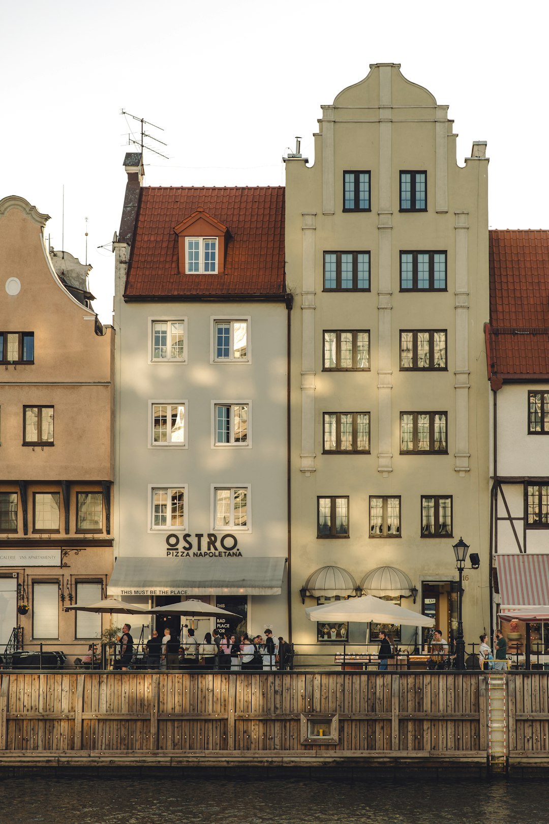 Waterfront restaurants with outdoor seating along the Motława River in Gdańsk Old Town, Poland