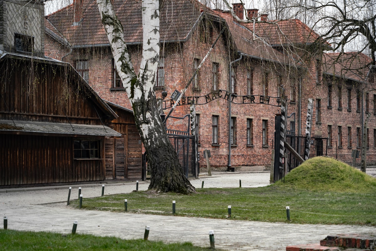 Auschwitz I main gate with the Arbeit Macht Frei inscription in the early morning