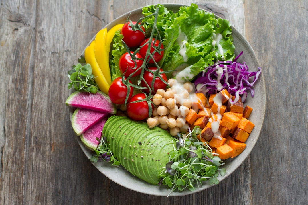 Plant-based dishes on a wooden table at a vegan restaurant in Warsaw, Poland