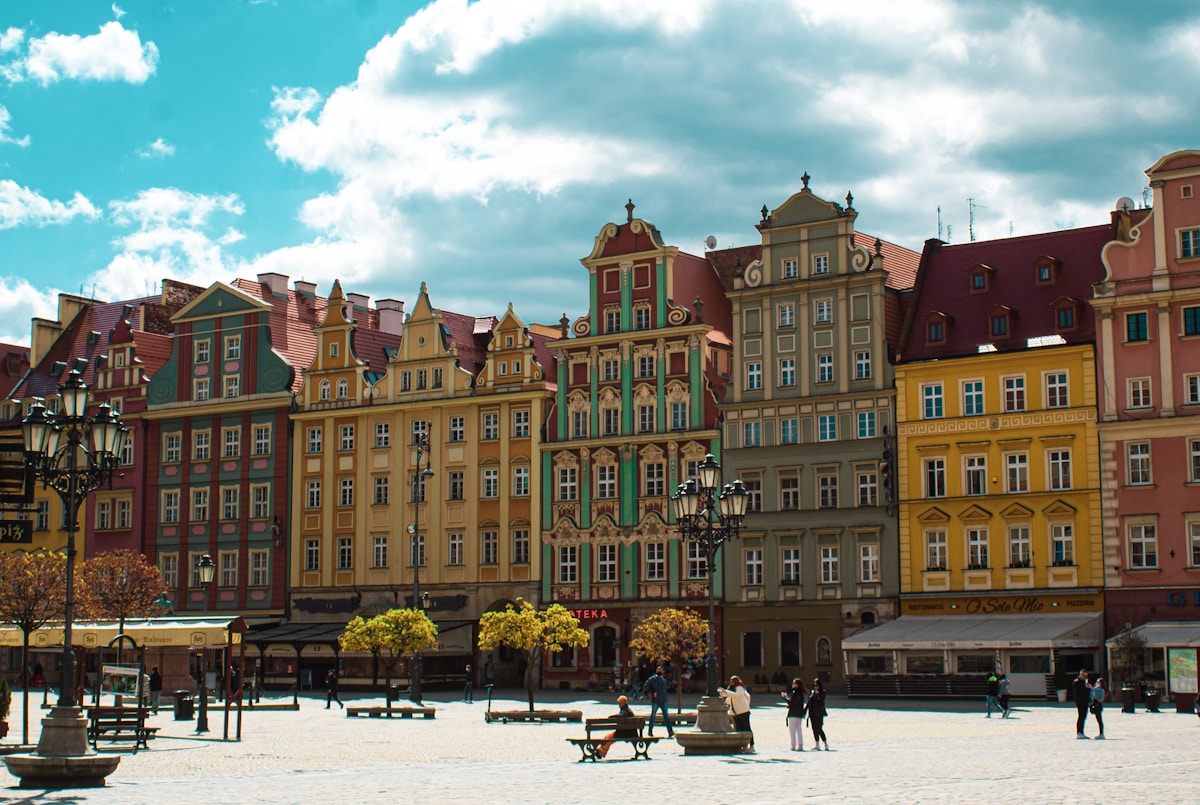 Wroclaw Market Square with colourful historic buildings and people in the old town, Poland
